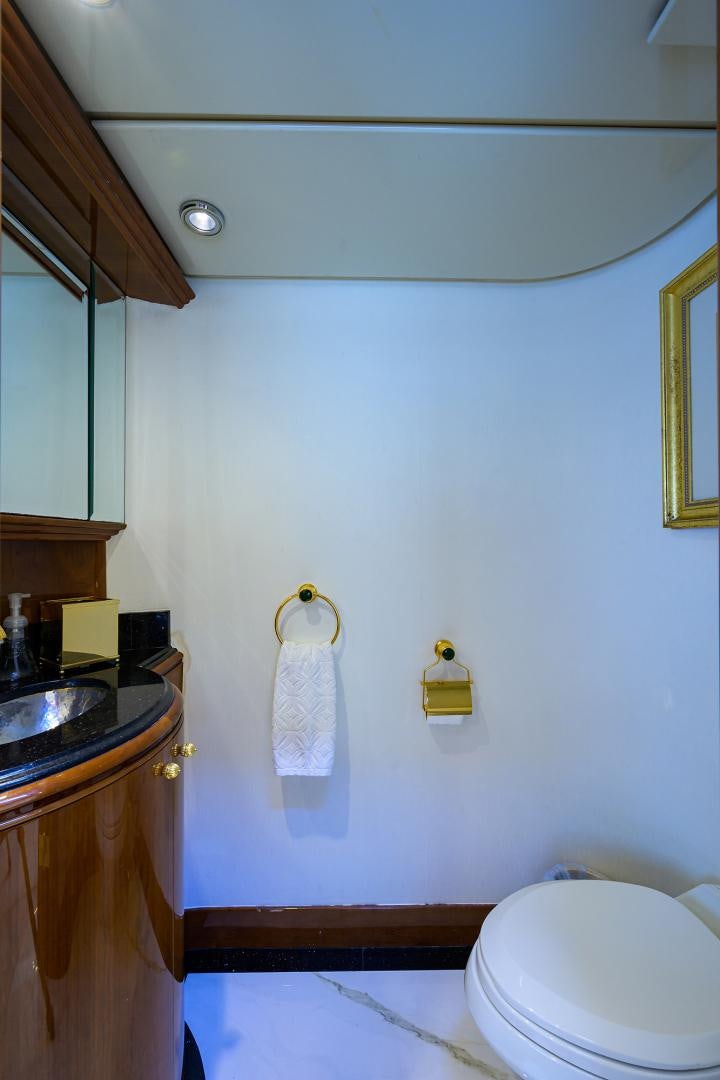 a bathroom with a toilet and sink aboard MY DESTINY Yacht for Sale