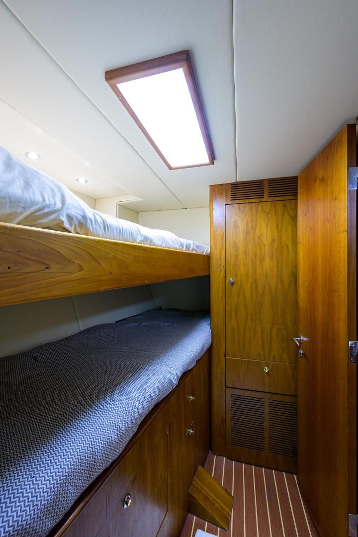 a room with a bed and a window aboard MY DESTINY Yacht for Sale
