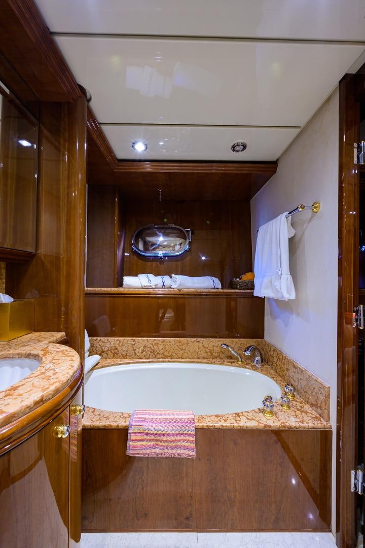 a bathroom with a large mirror aboard MY DESTINY Yacht for Sale