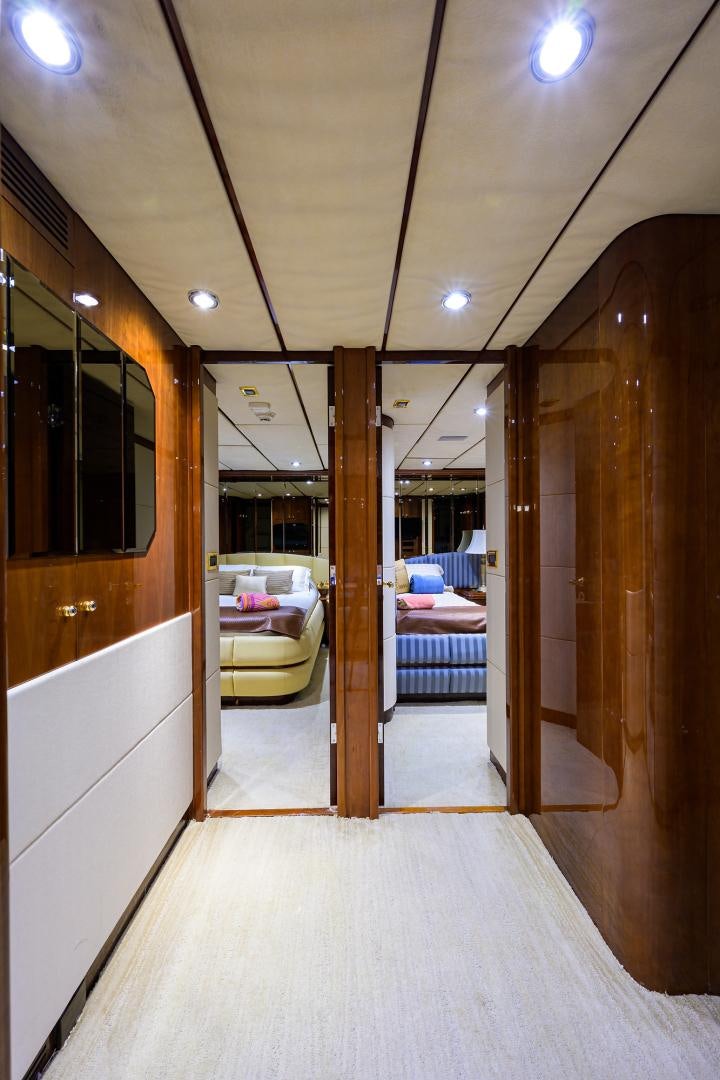 a room with a bed and a mirror aboard MY DESTINY Yacht for Sale