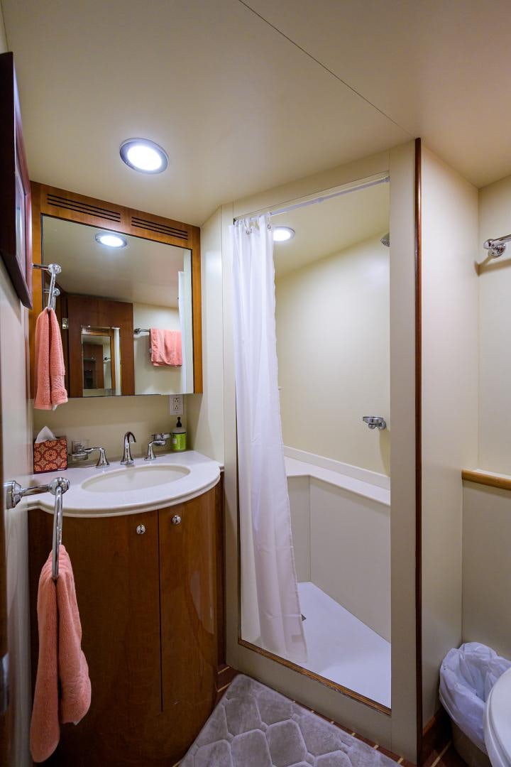 a bathroom with a sink and a mirror aboard MY DESTINY Yacht for Sale