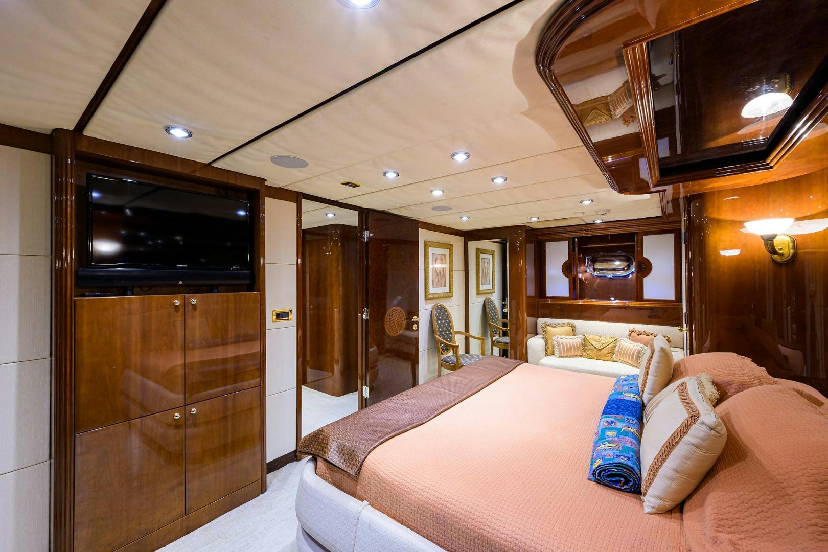 a hotel room with a bed and tv aboard MY DESTINY Yacht for Sale
