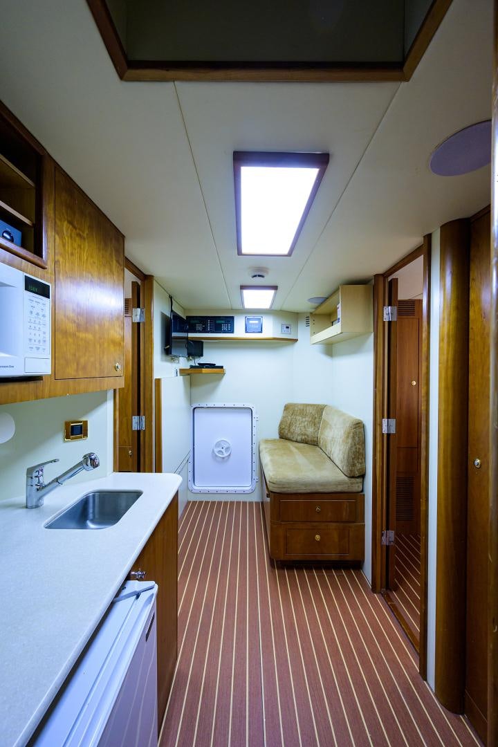 a small bathroom with a pink floor aboard MY DESTINY Yacht for Sale