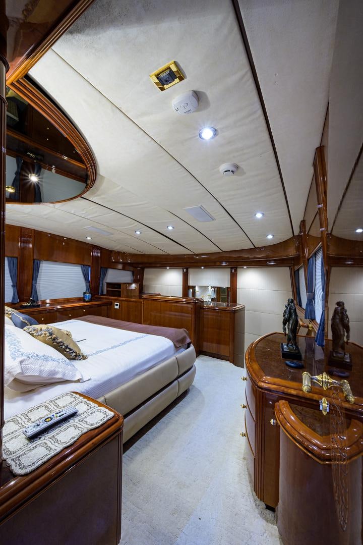 a room with a bed and a desk aboard MY DESTINY Yacht for Sale
