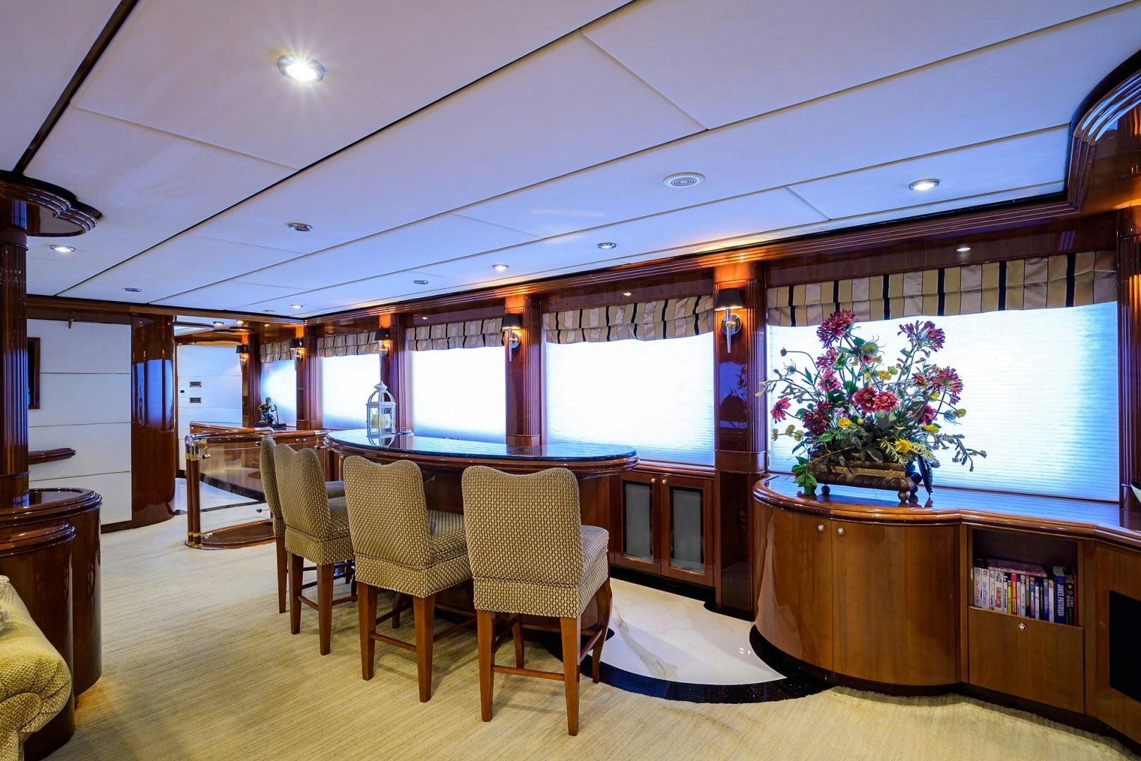 a room with a table and chairs aboard MY DESTINY Yacht for Sale