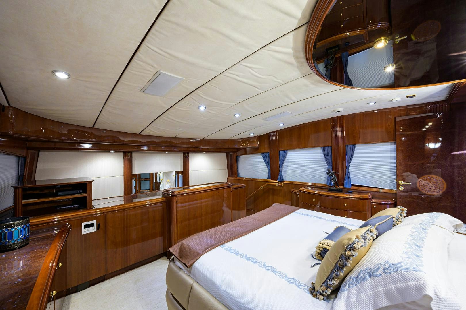 a room with a bed and a mirror aboard MY DESTINY Yacht for Sale
