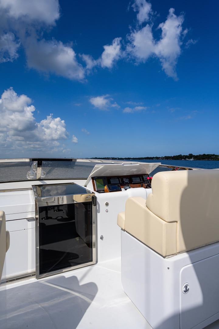 a white car with a door open aboard MY DESTINY Yacht for Sale