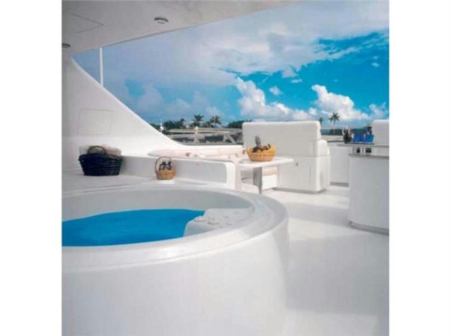 a large white room with a large window and a pool aboard MY DESTINY Yacht for Sale