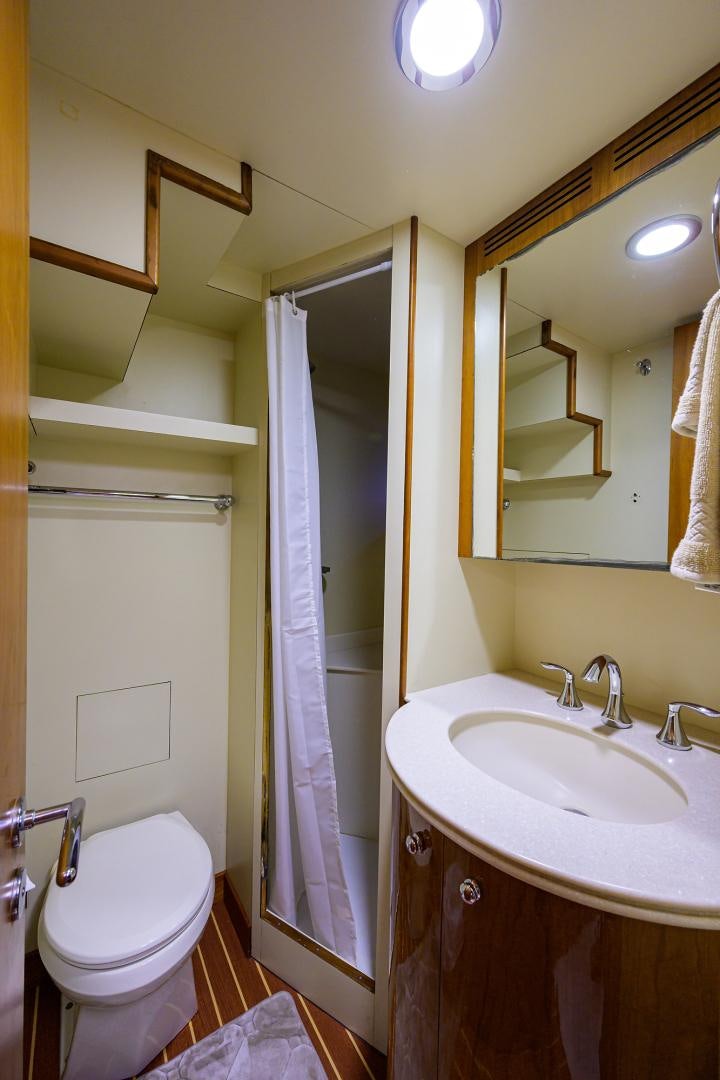 a bathroom with a toilet and sink aboard MY DESTINY Yacht for Sale