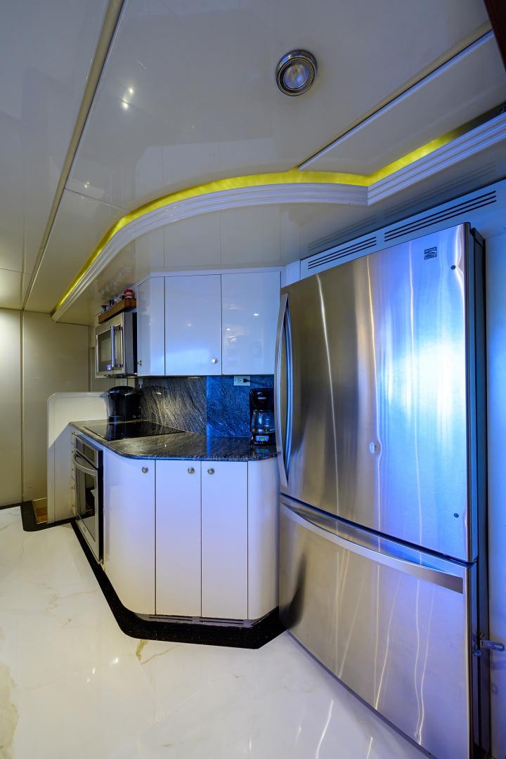 a kitchen with a stainless steel refrigerator aboard MY DESTINY Yacht for Sale