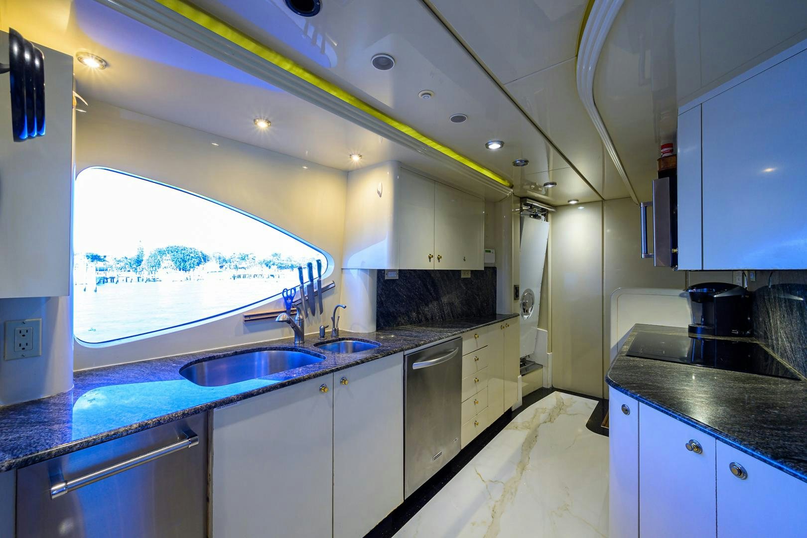 a kitchen with a large window aboard MY DESTINY Yacht for Sale