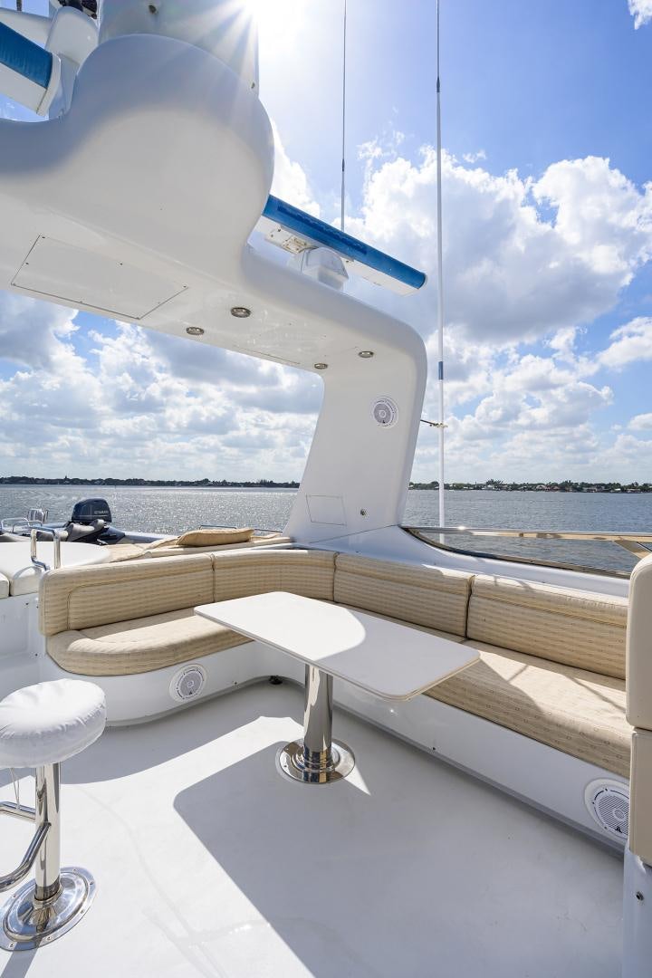 a white boat on a deck aboard MY DESTINY Yacht for Sale