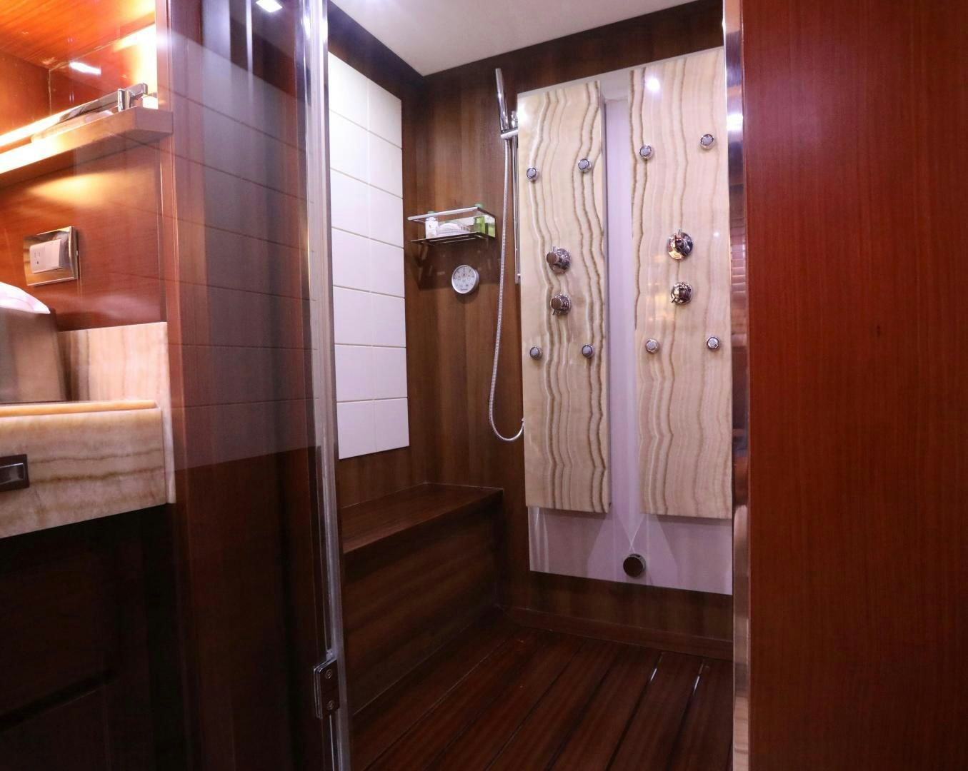 a bathroom with a shower and sink aboard ANDREIKA Yacht for Sale