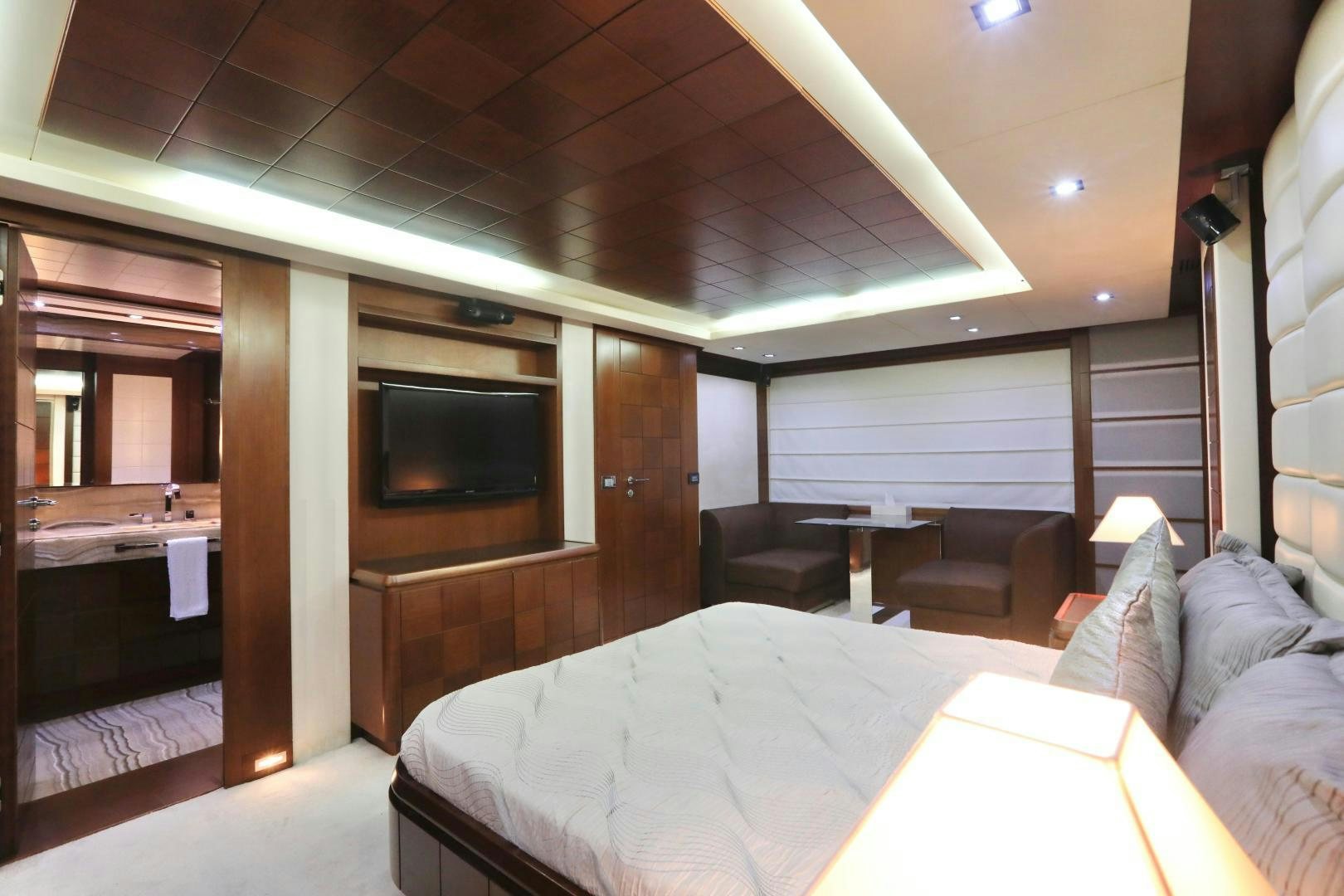 a room with a bed and a television aboard ANDREIKA Yacht for Sale