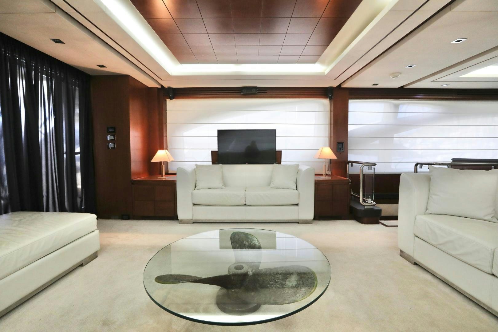 a living room with a large screen aboard ANDREIKA Yacht for Sale