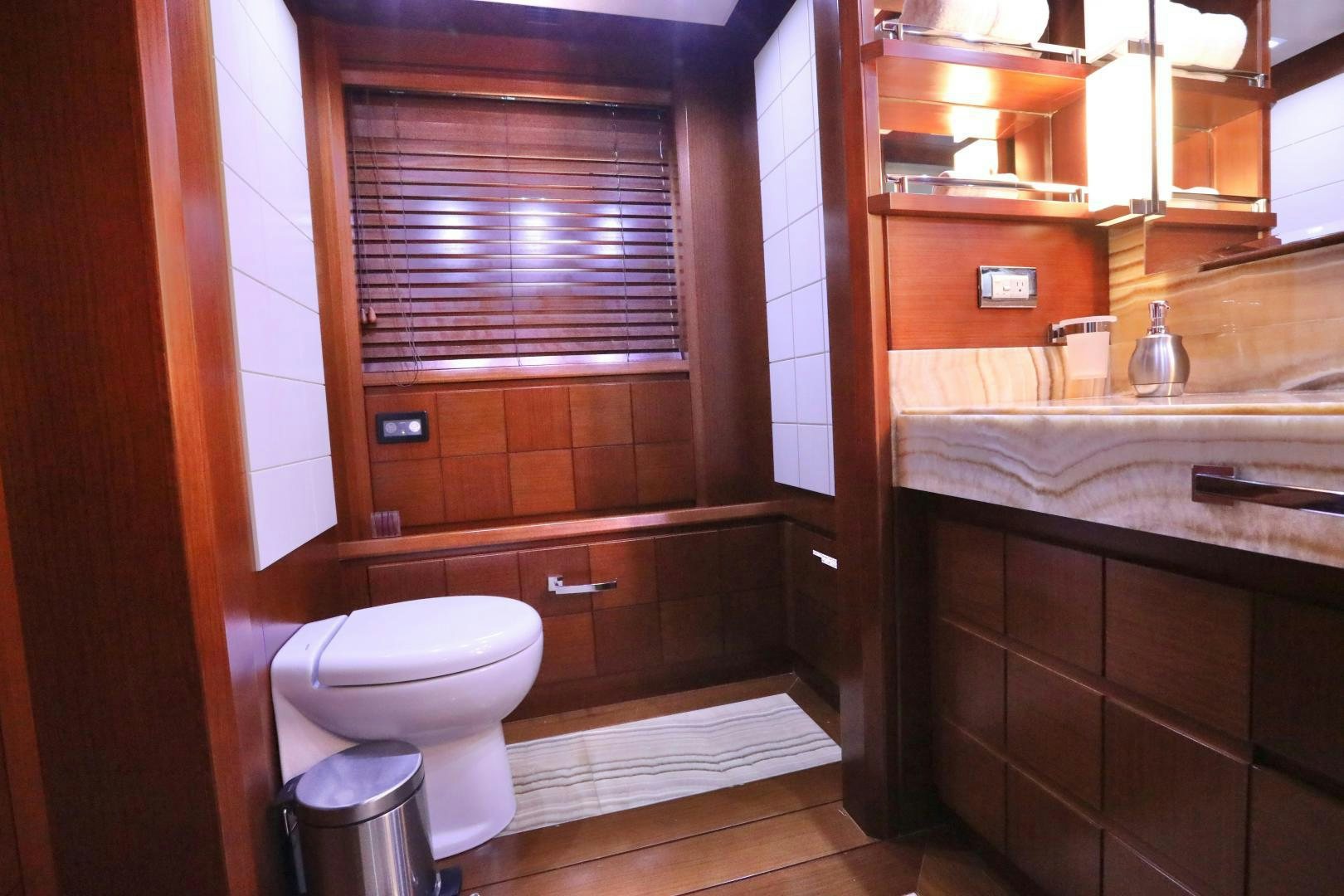 a bathroom with a toilet and a sink aboard ANDREIKA Yacht for Sale