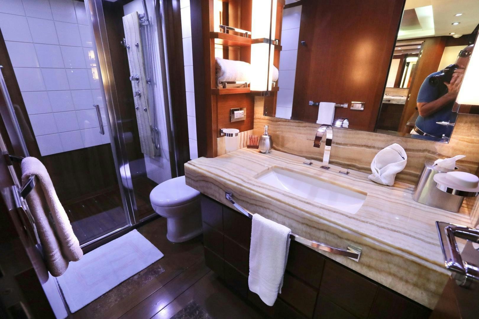 a bathroom with a large mirror aboard ANDREIKA Yacht for Sale