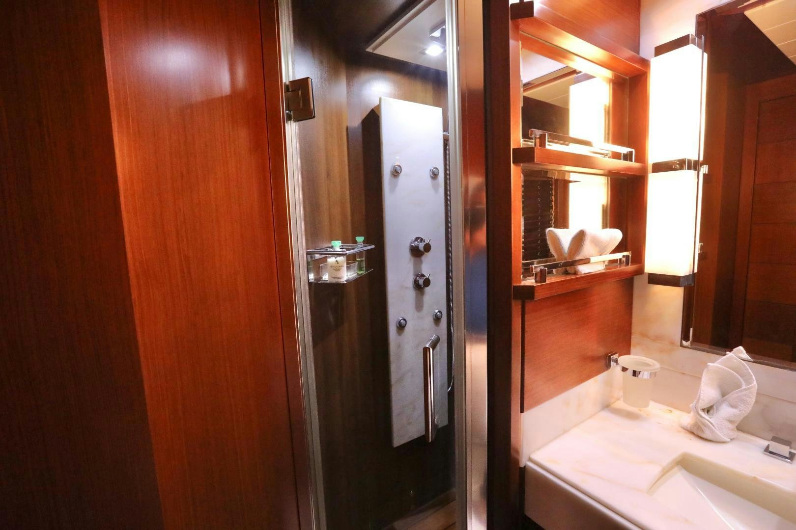 a bathroom with a large mirror aboard ANDREIKA Yacht for Sale