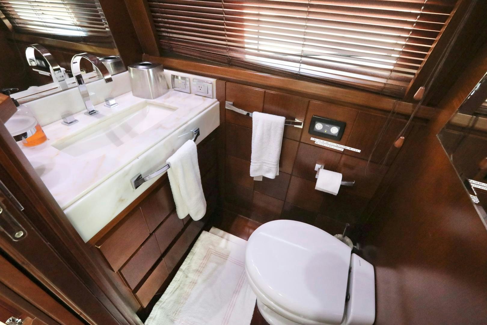 a bathroom with a sink and toilet aboard ANDREIKA Yacht for Sale