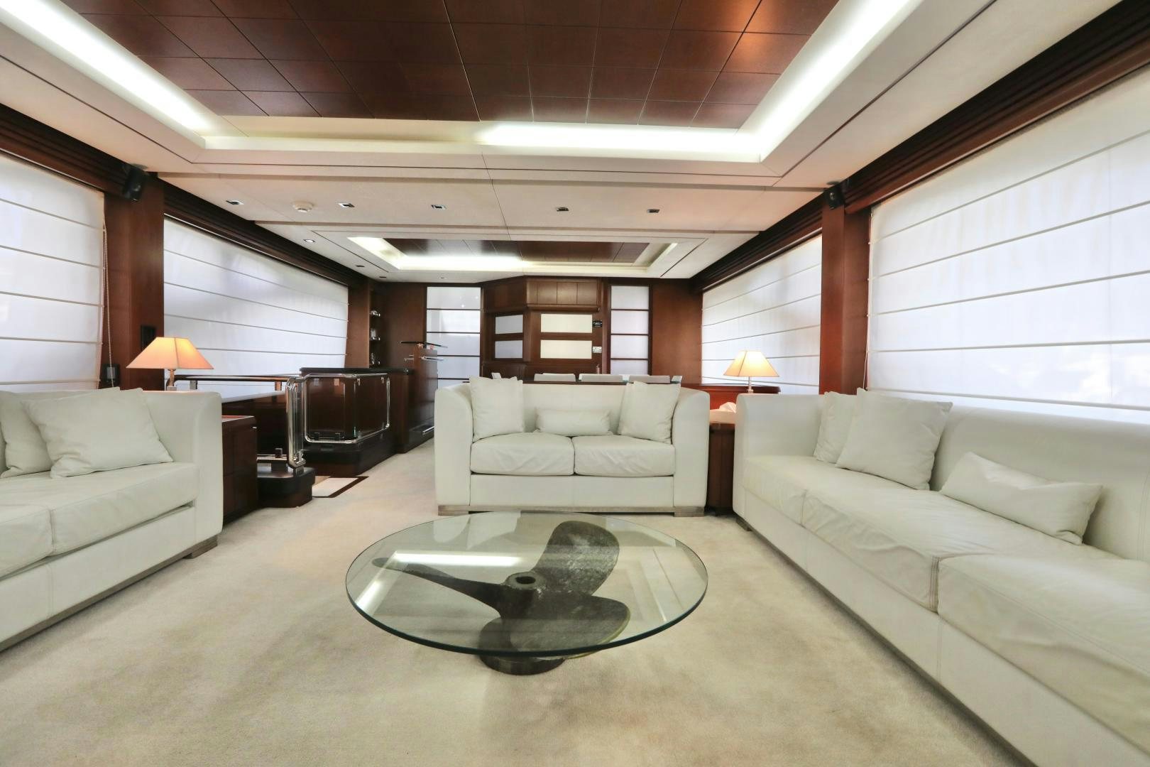 a living room with a couch and a coffee table aboard ANDREIKA Yacht for Sale