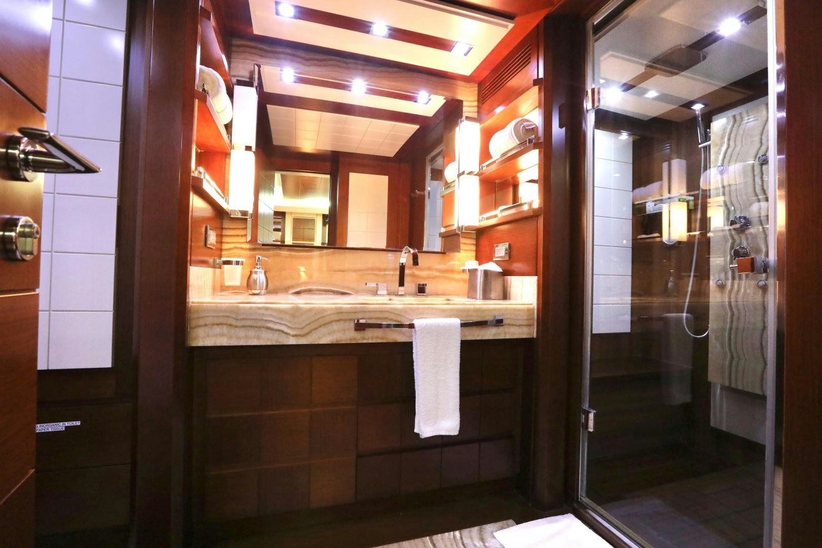 a bathroom with a large mirror aboard ANDREIKA Yacht for Sale