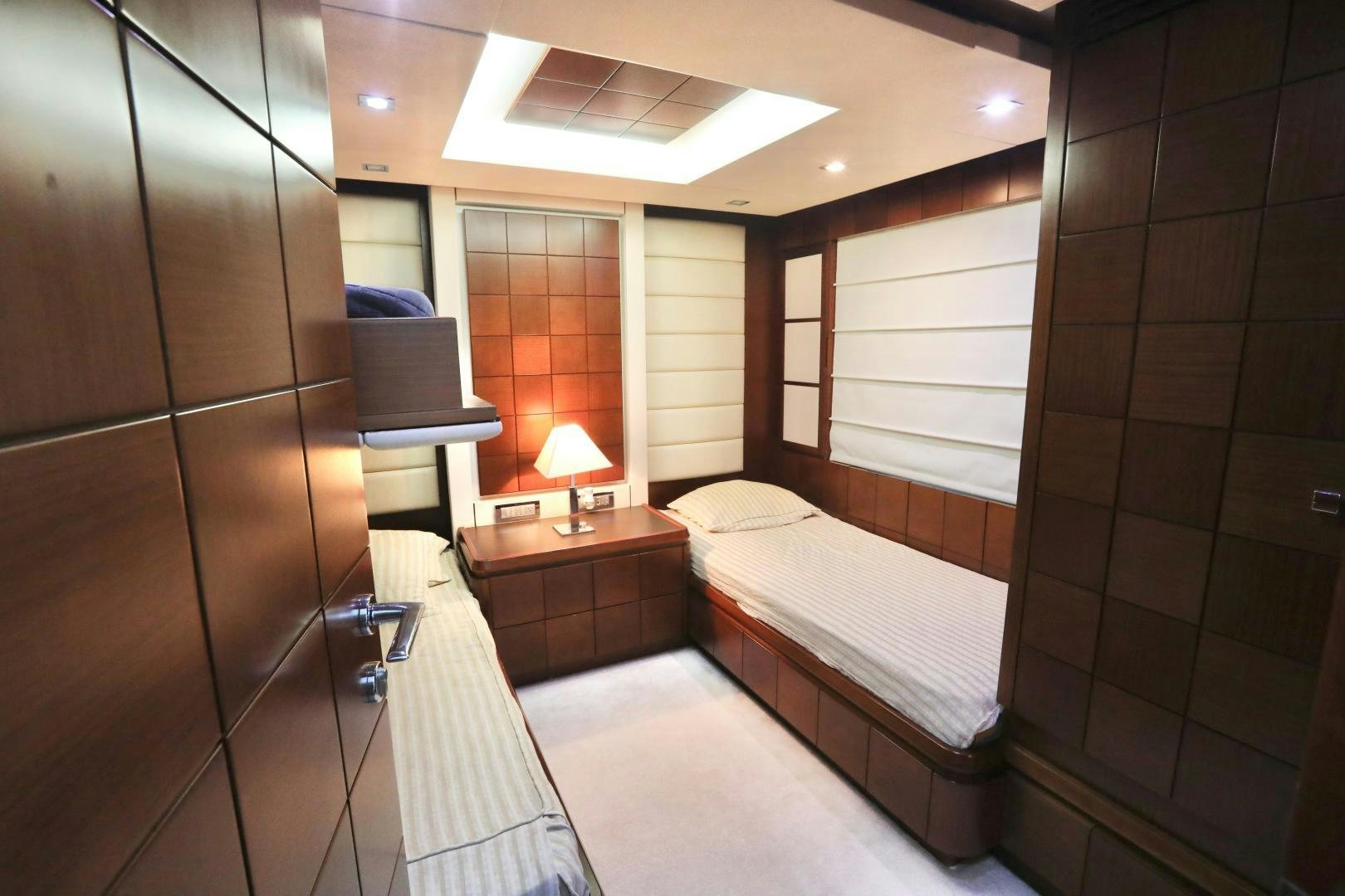 a room with a bed and a mirror aboard ANDREIKA Yacht for Sale