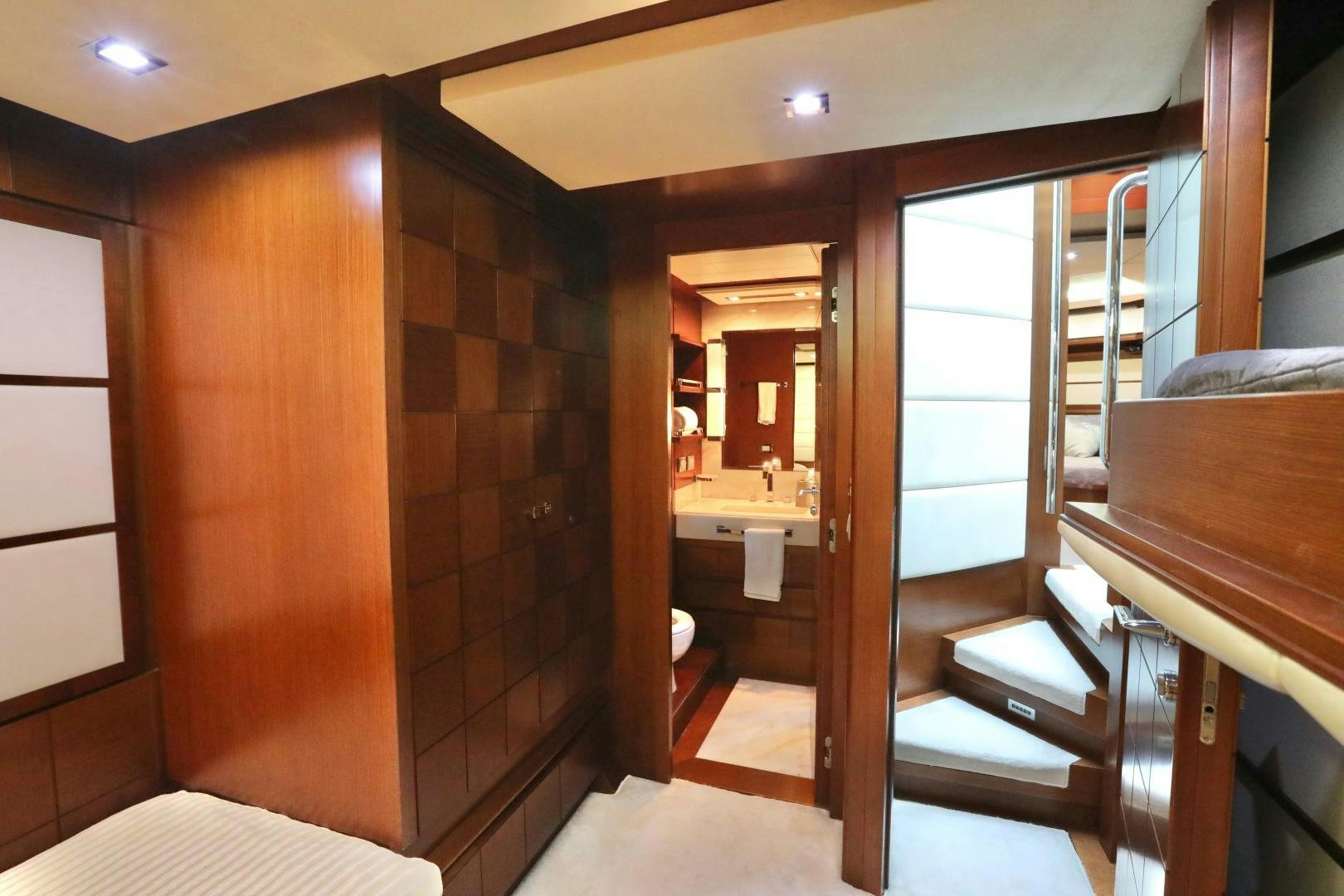 a room with a brick wall and a wood door aboard ANDREIKA Yacht for Sale