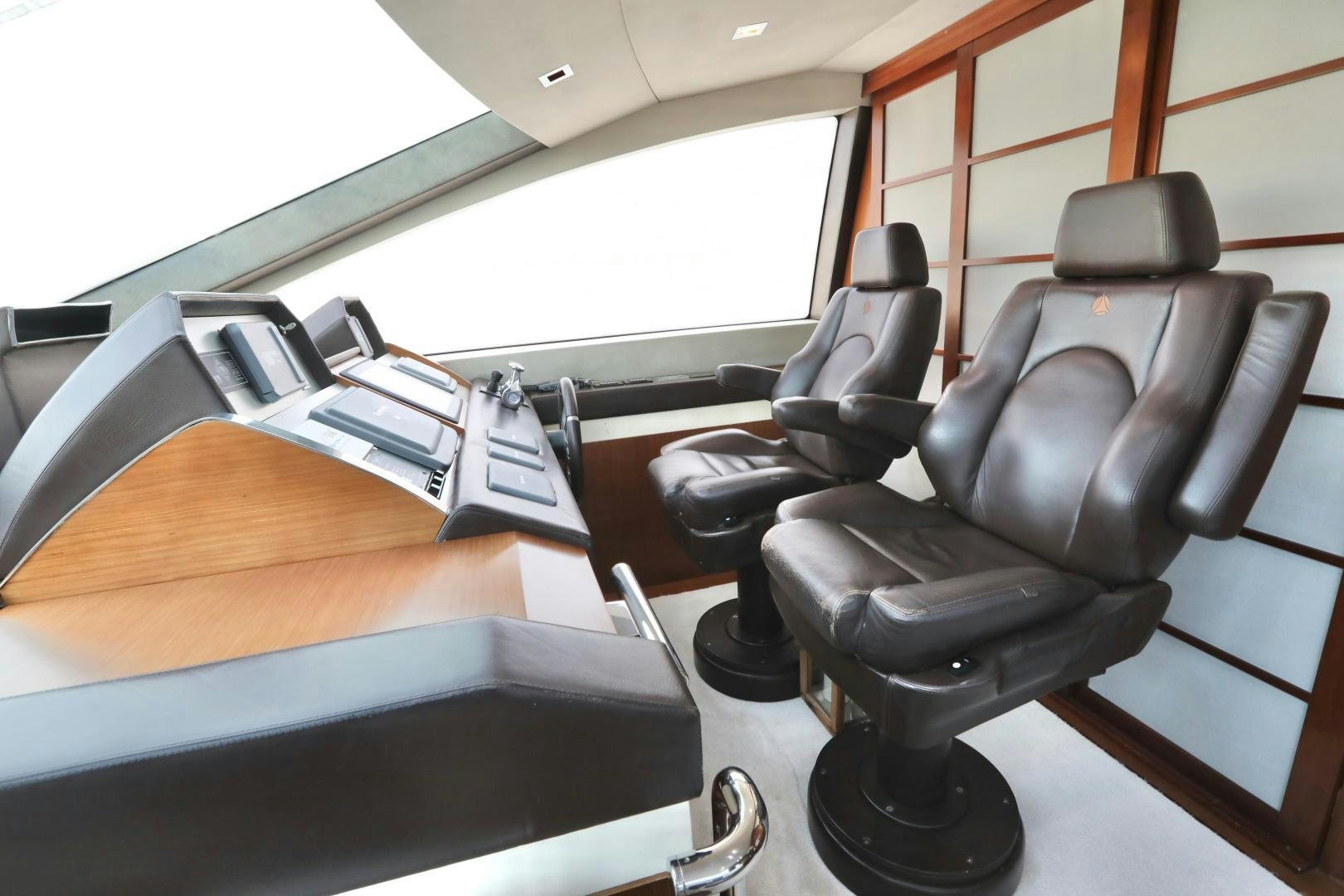 a black office chair next to a black desk with a black chair aboard ANDREIKA Yacht for Sale