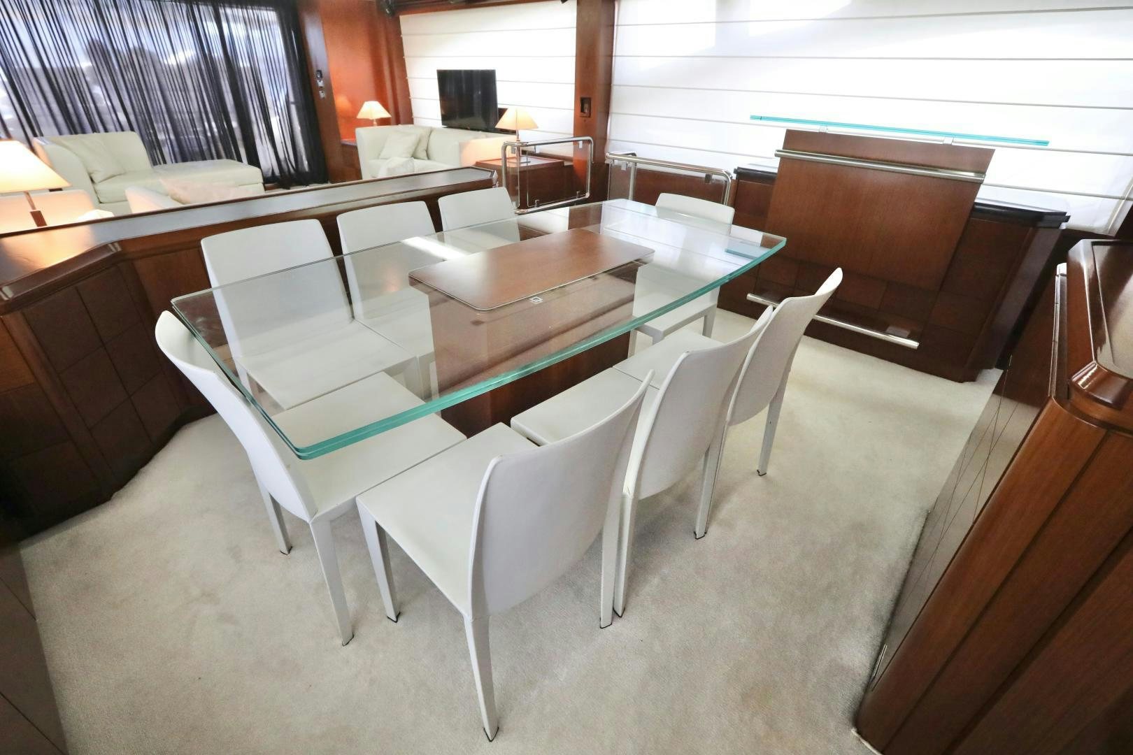 a room with a table chairs and a couch aboard ANDREIKA Yacht for Sale