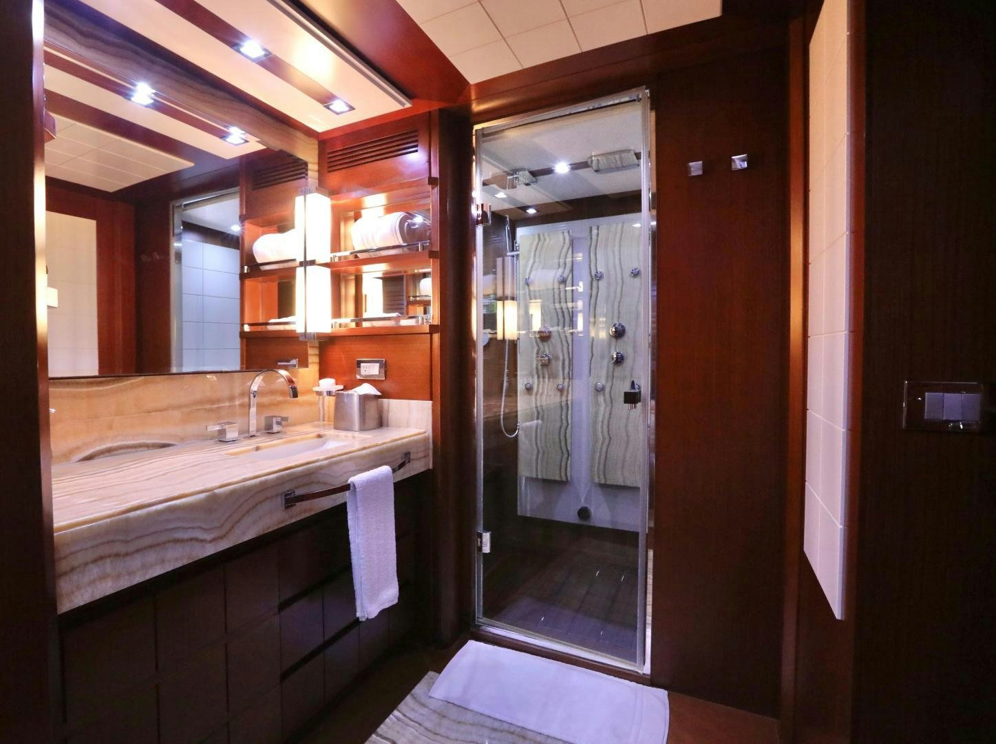 a bathroom with a large mirror aboard ANDREIKA Yacht for Sale