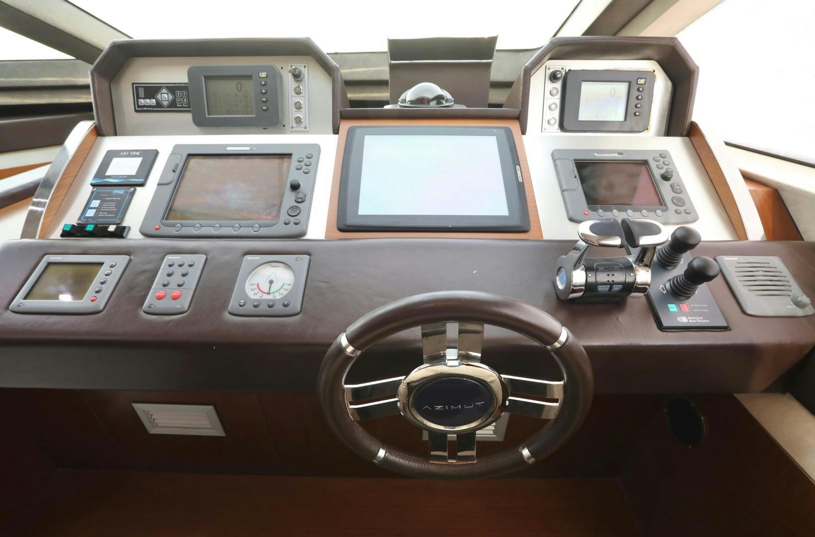 a wooden box with a camera and a couple of pictures on it aboard ANDREIKA Yacht for Sale