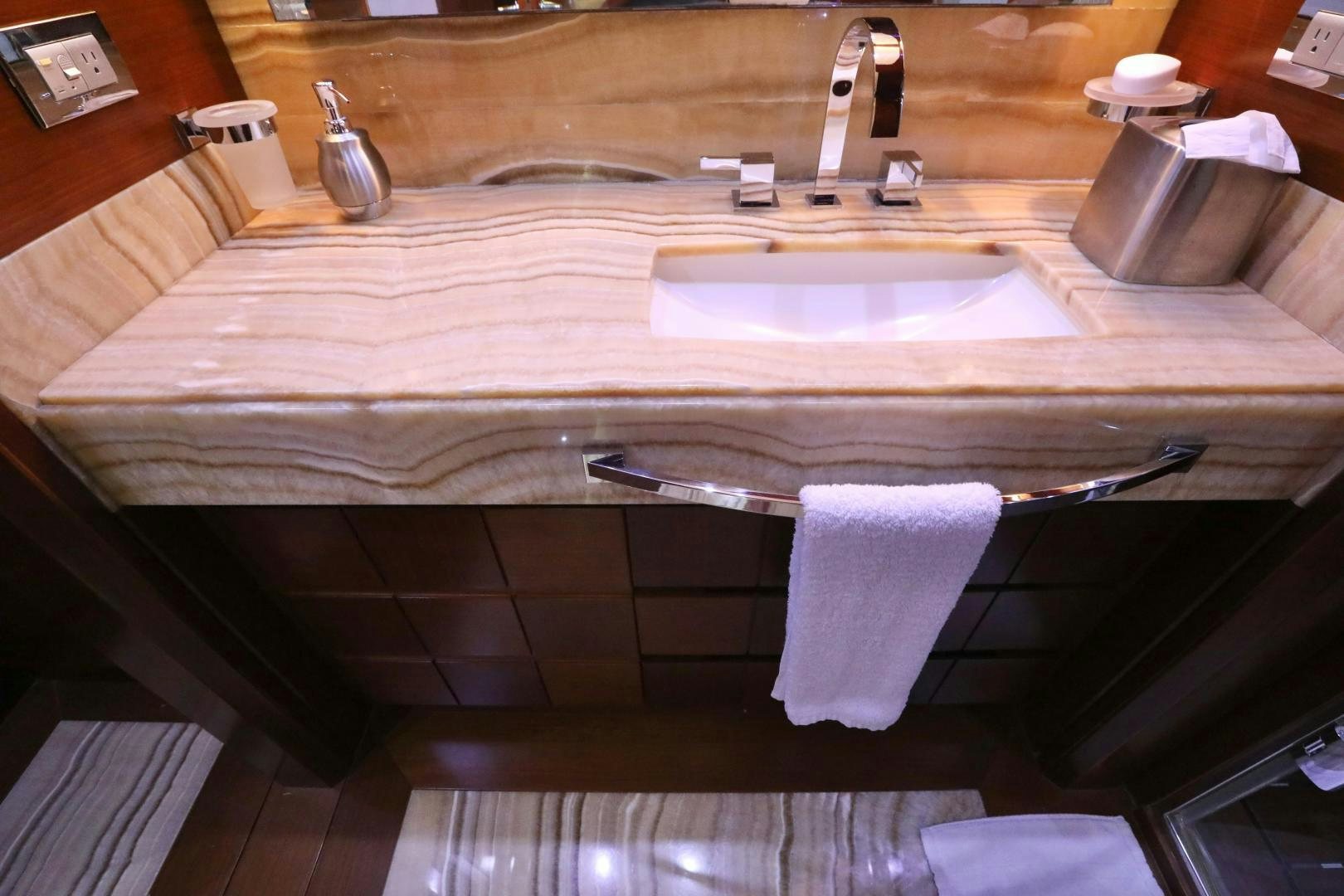 a bathroom with a sink and a mirror aboard ANDREIKA Yacht for Sale