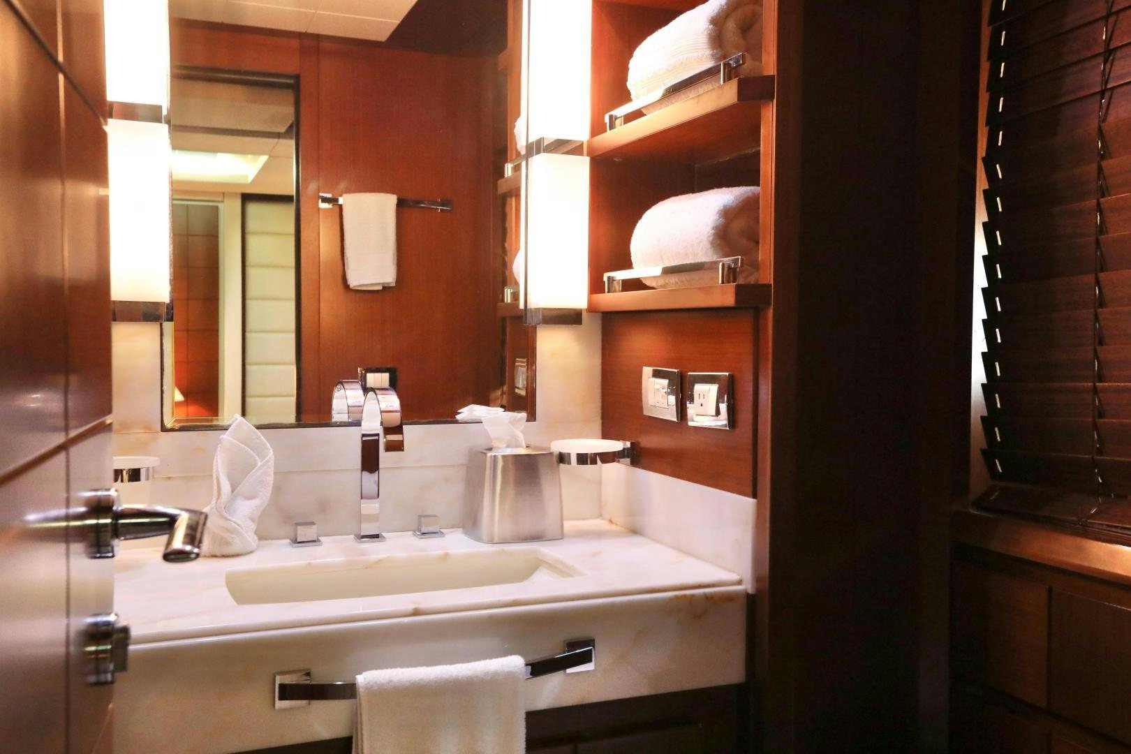 a bathroom with a large mirror aboard ANDREIKA Yacht for Sale