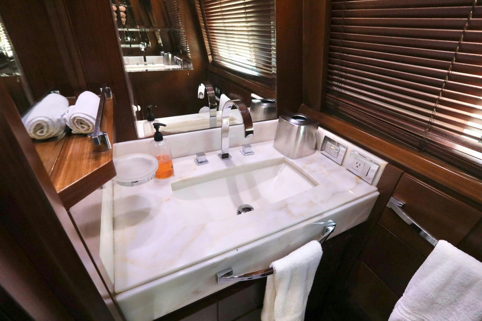 a bathroom with a sink and a mirror aboard ANDREIKA Yacht for Sale