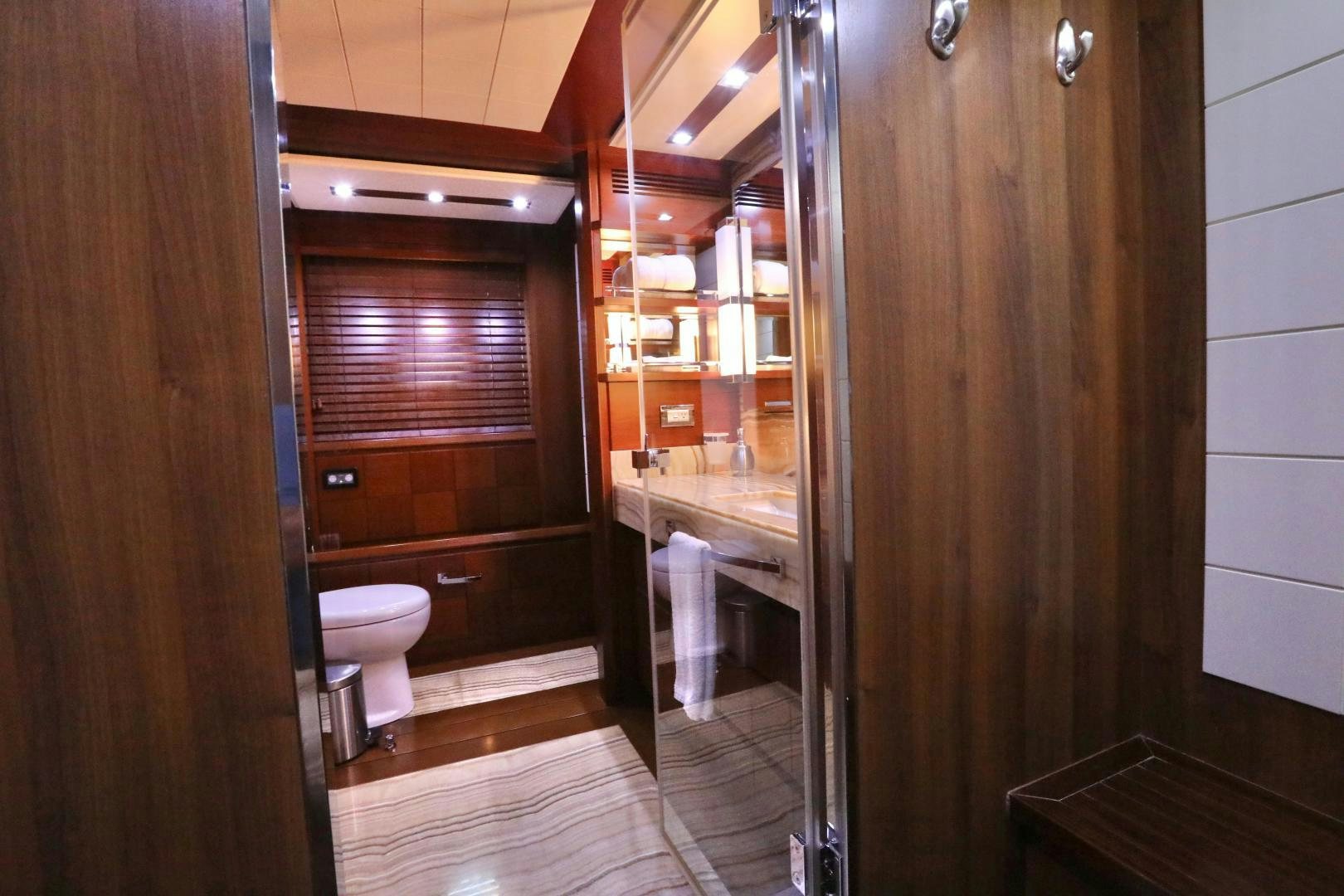 a bathroom with wooden cabinets aboard ANDREIKA Yacht for Sale