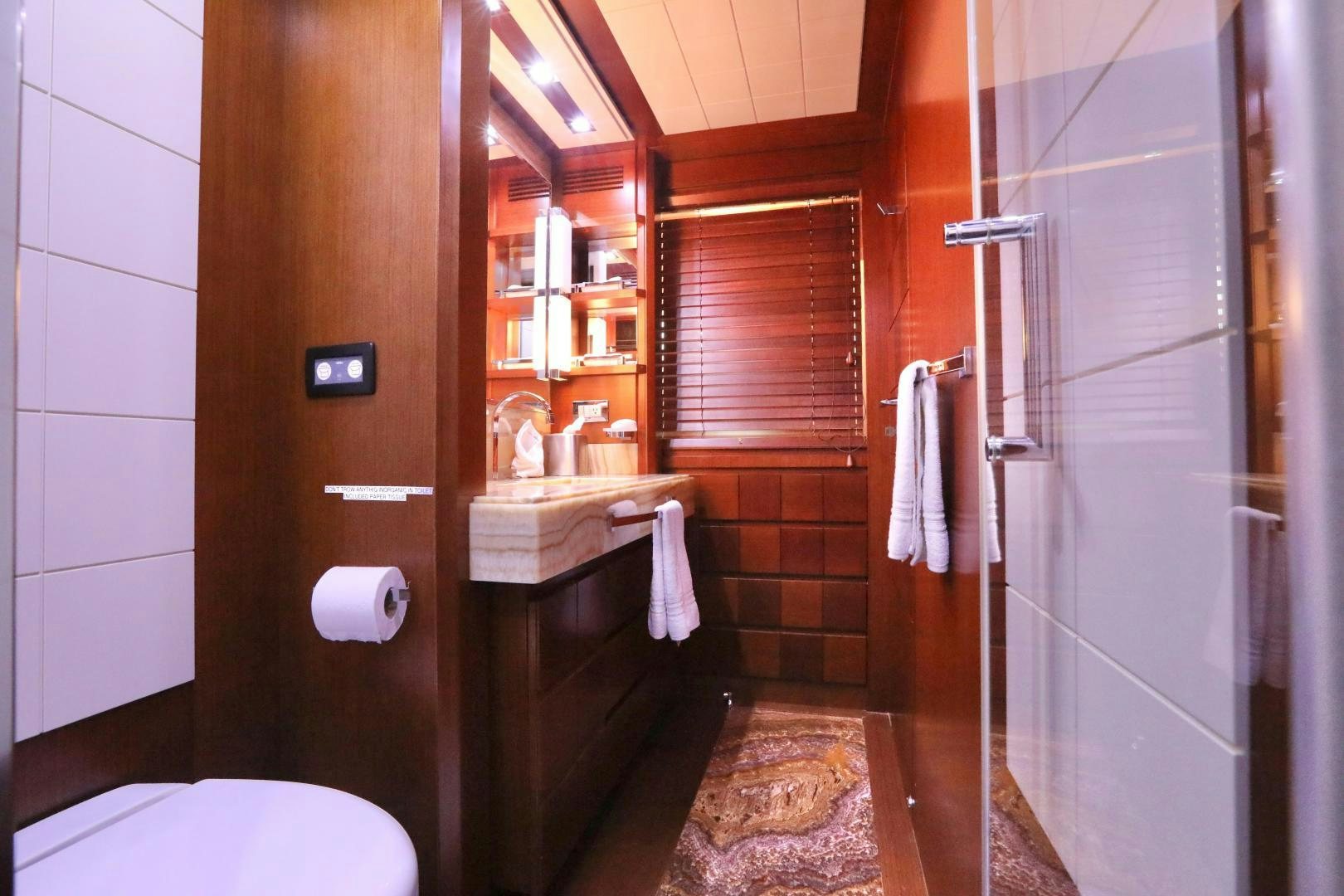 a bathroom with a shower and toilet aboard ANDREIKA Yacht for Sale