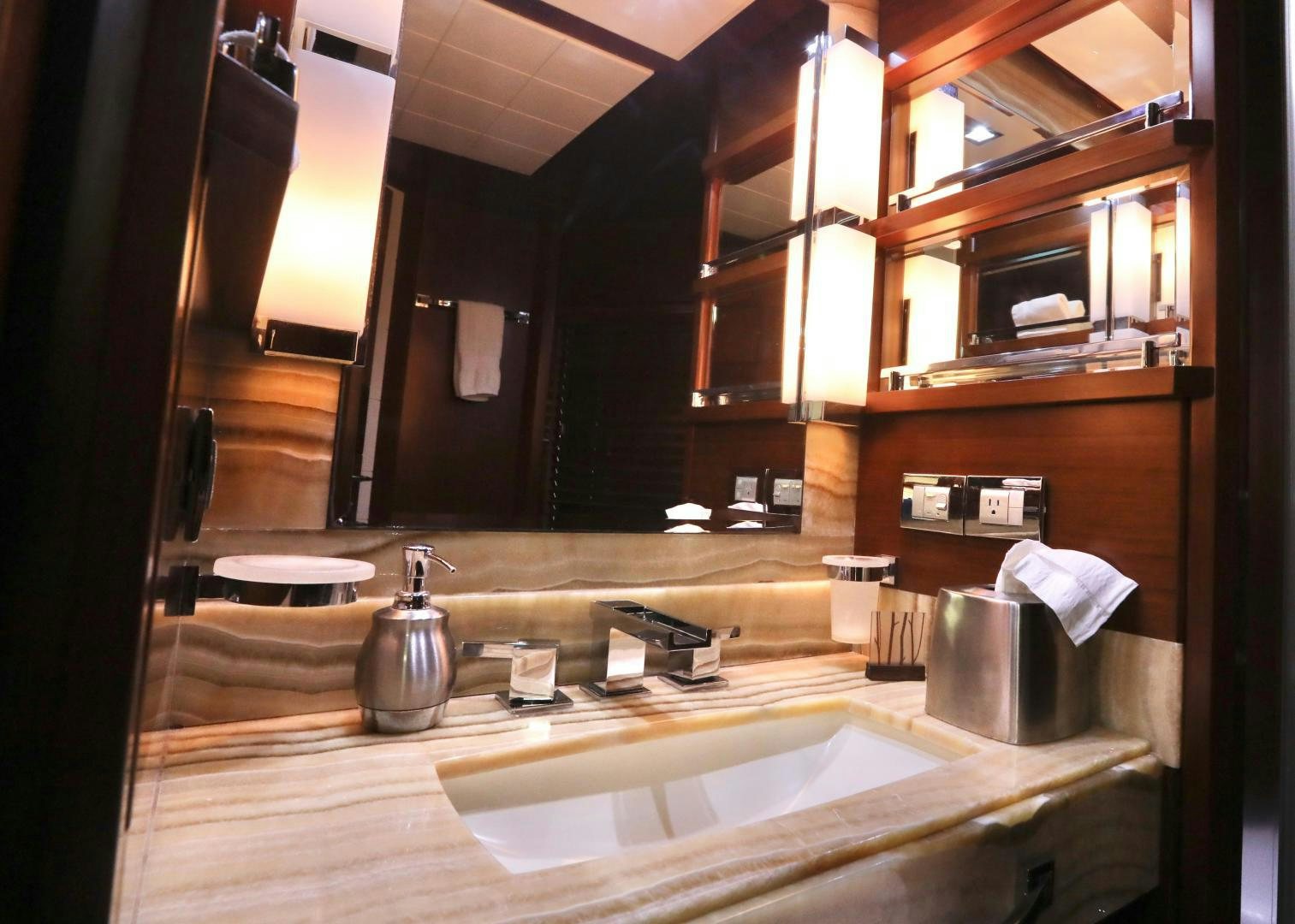 a bathroom with a large mirror aboard ANDREIKA Yacht for Sale