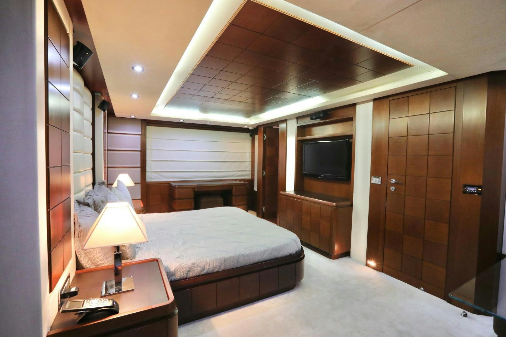 a hotel room with a bed and a tv aboard ANDREIKA Yacht for Sale