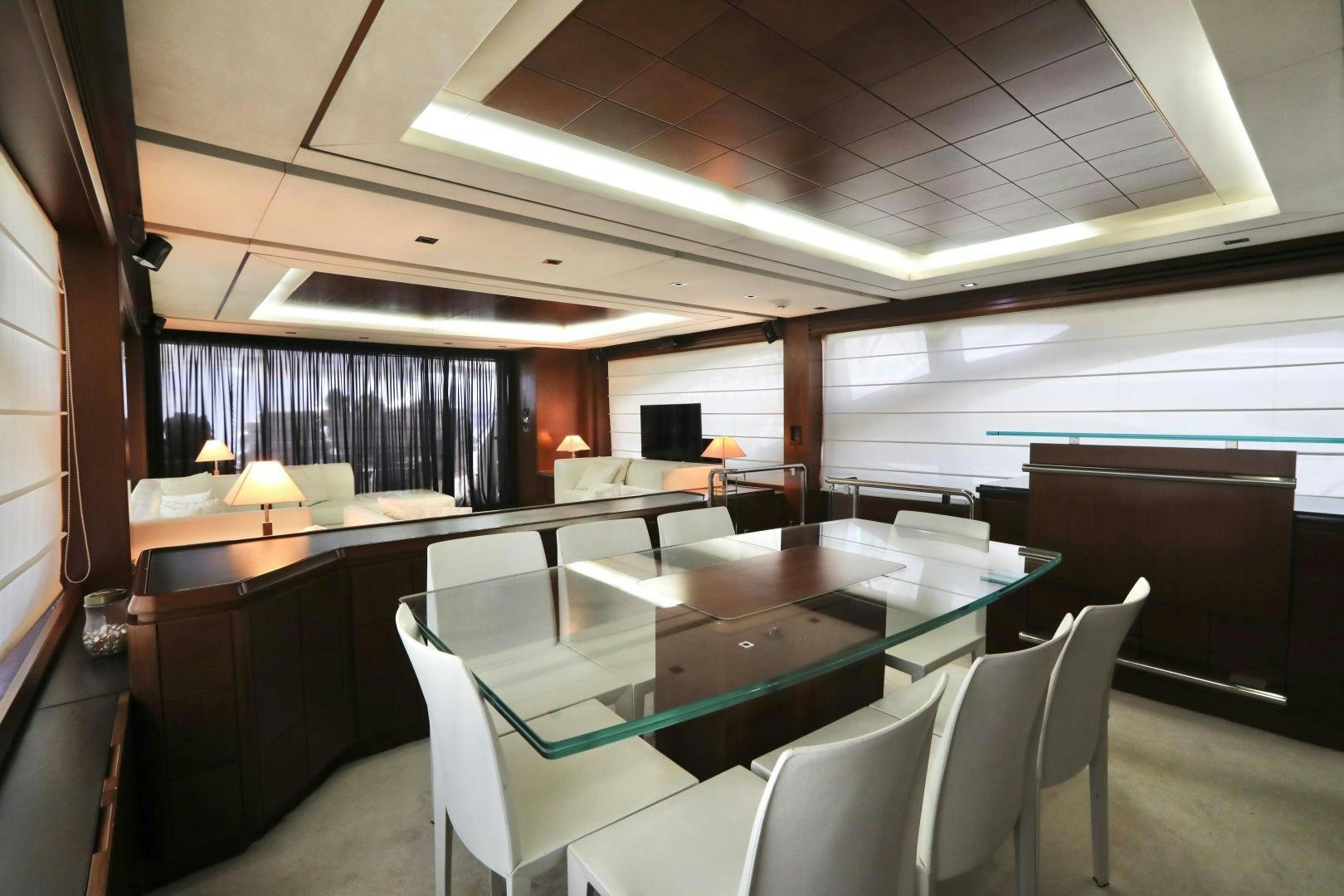 a room with a table and chairs aboard ANDREIKA Yacht for Sale