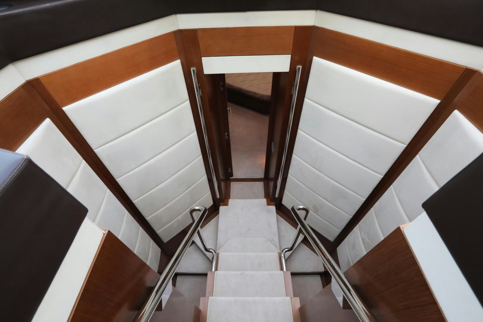 a wooden staircase with a railing aboard ANDREIKA Yacht for Sale