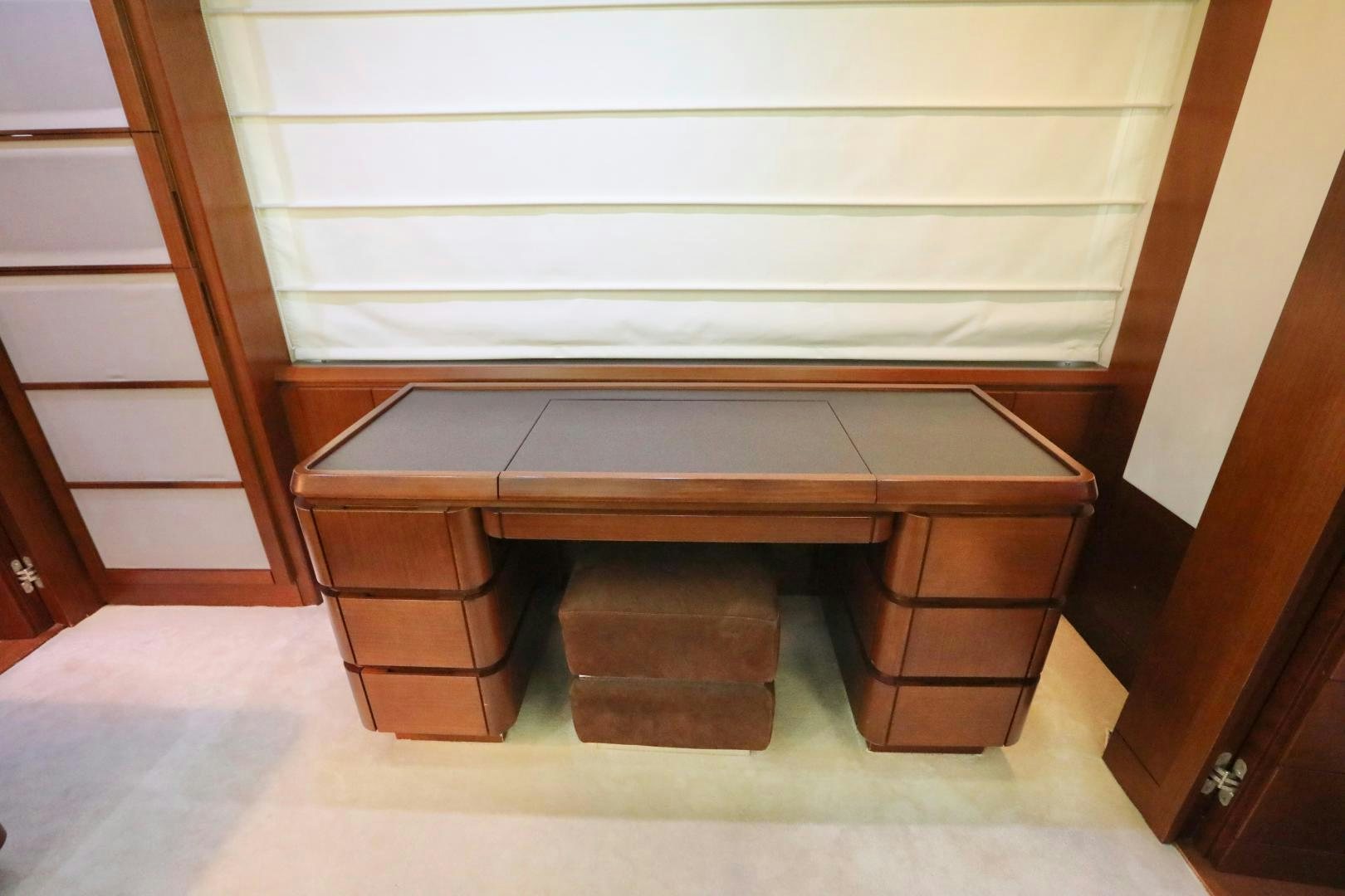 a wooden shelf with a white wall aboard ANDREIKA Yacht for Sale