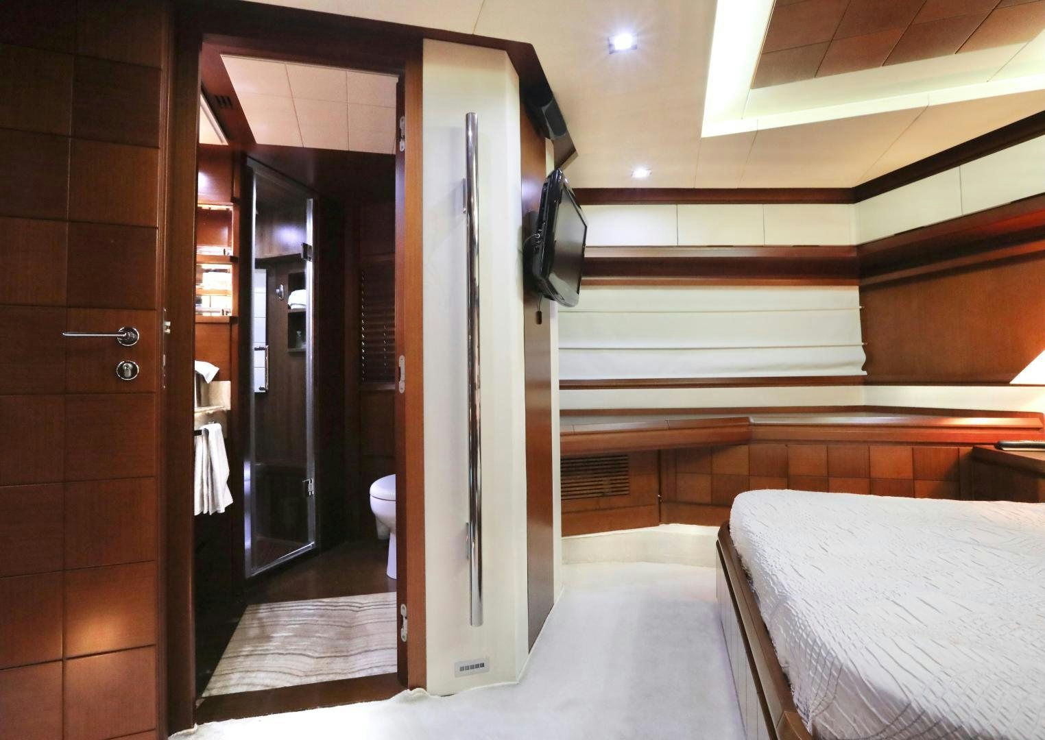 a room with a bed and a door aboard ANDREIKA Yacht for Sale