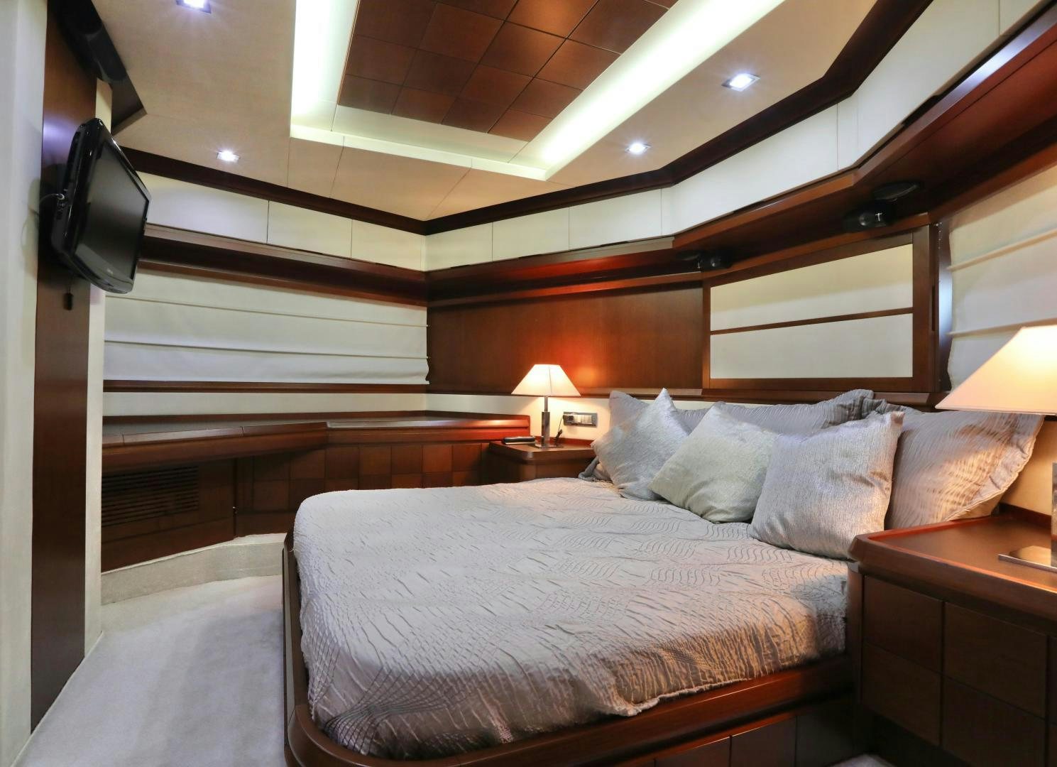 a bed with a white comforter aboard ANDREIKA Yacht for Sale