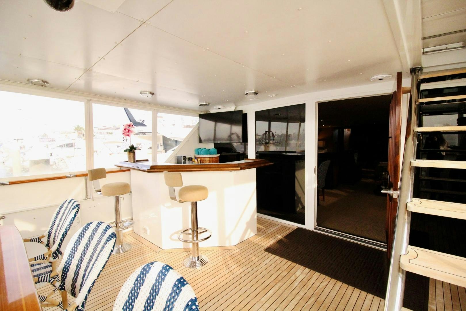 a room with a table and chairs aboard REFLECTIONS Yacht for Sale
