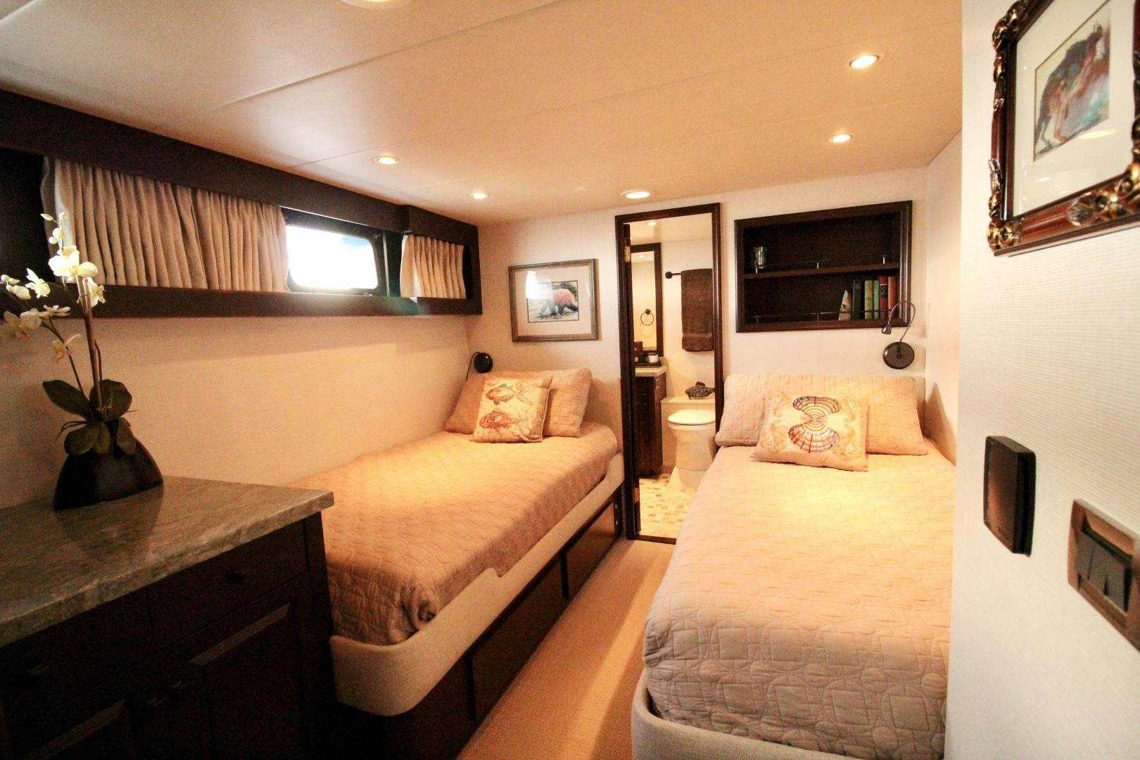 a bedroom with two beds aboard REFLECTIONS Yacht for Sale