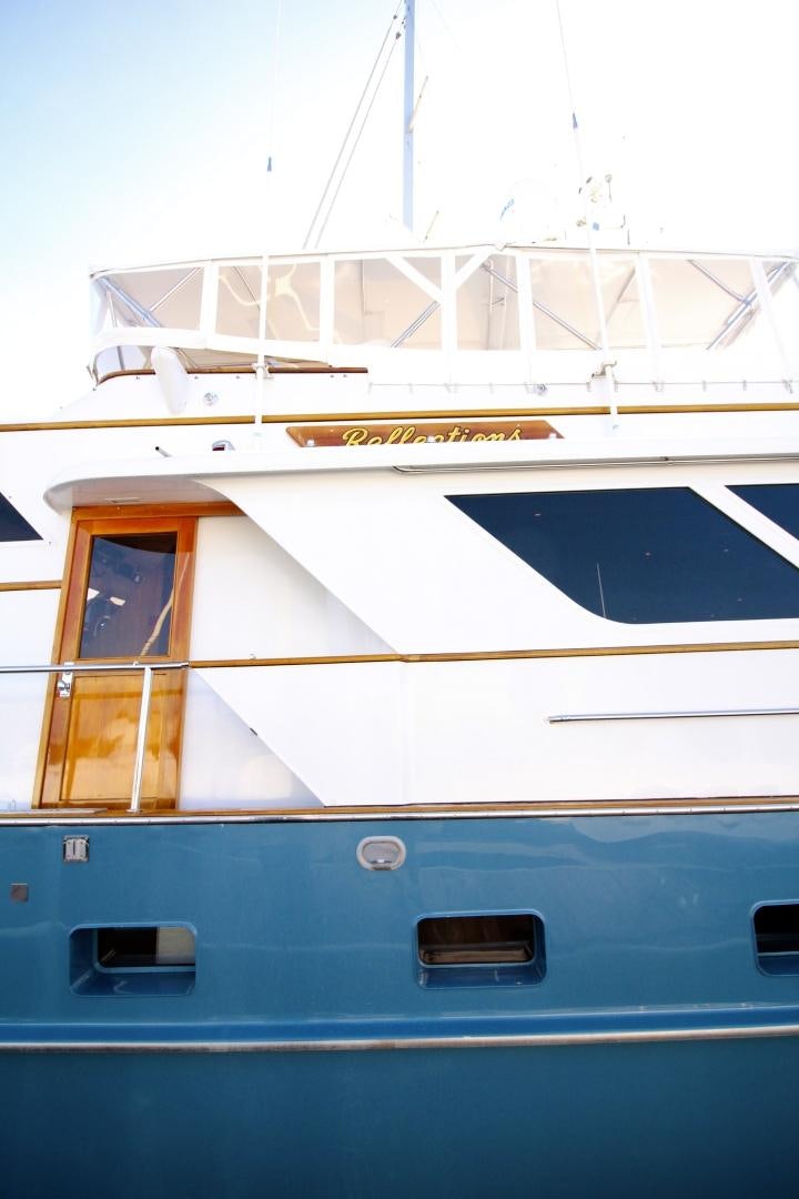 a boat with a window aboard REFLECTIONS Yacht for Sale