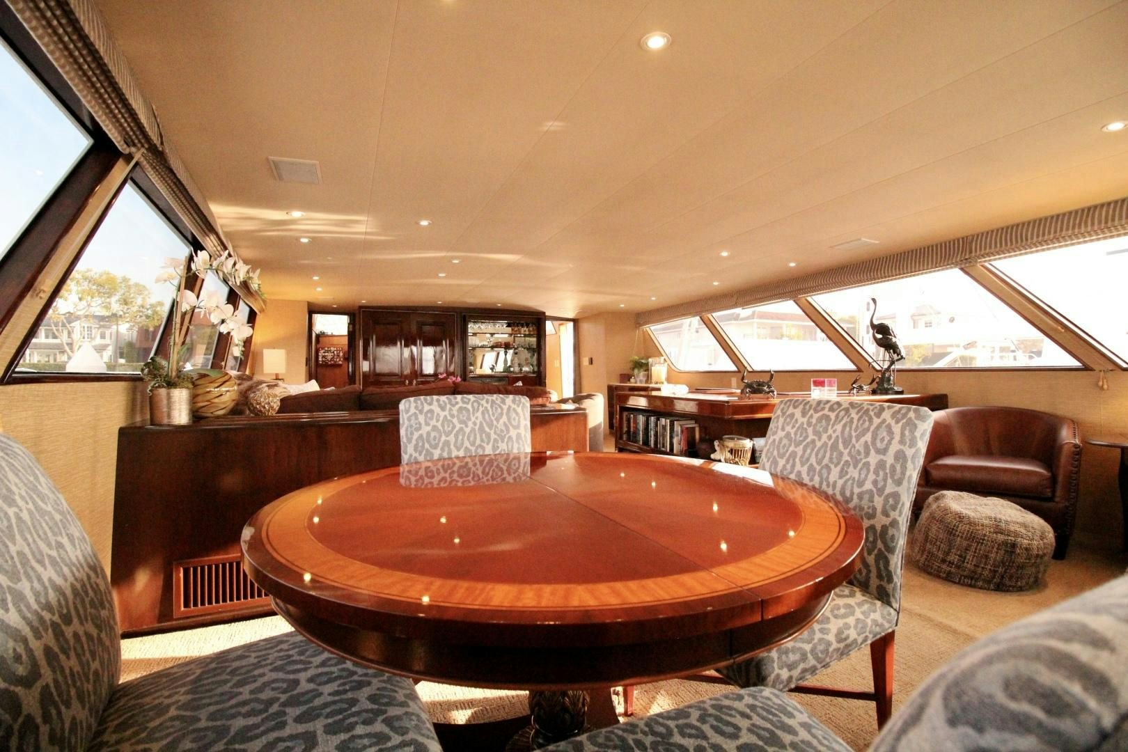 a table and chairs in a room aboard REFLECTIONS Yacht for Sale
