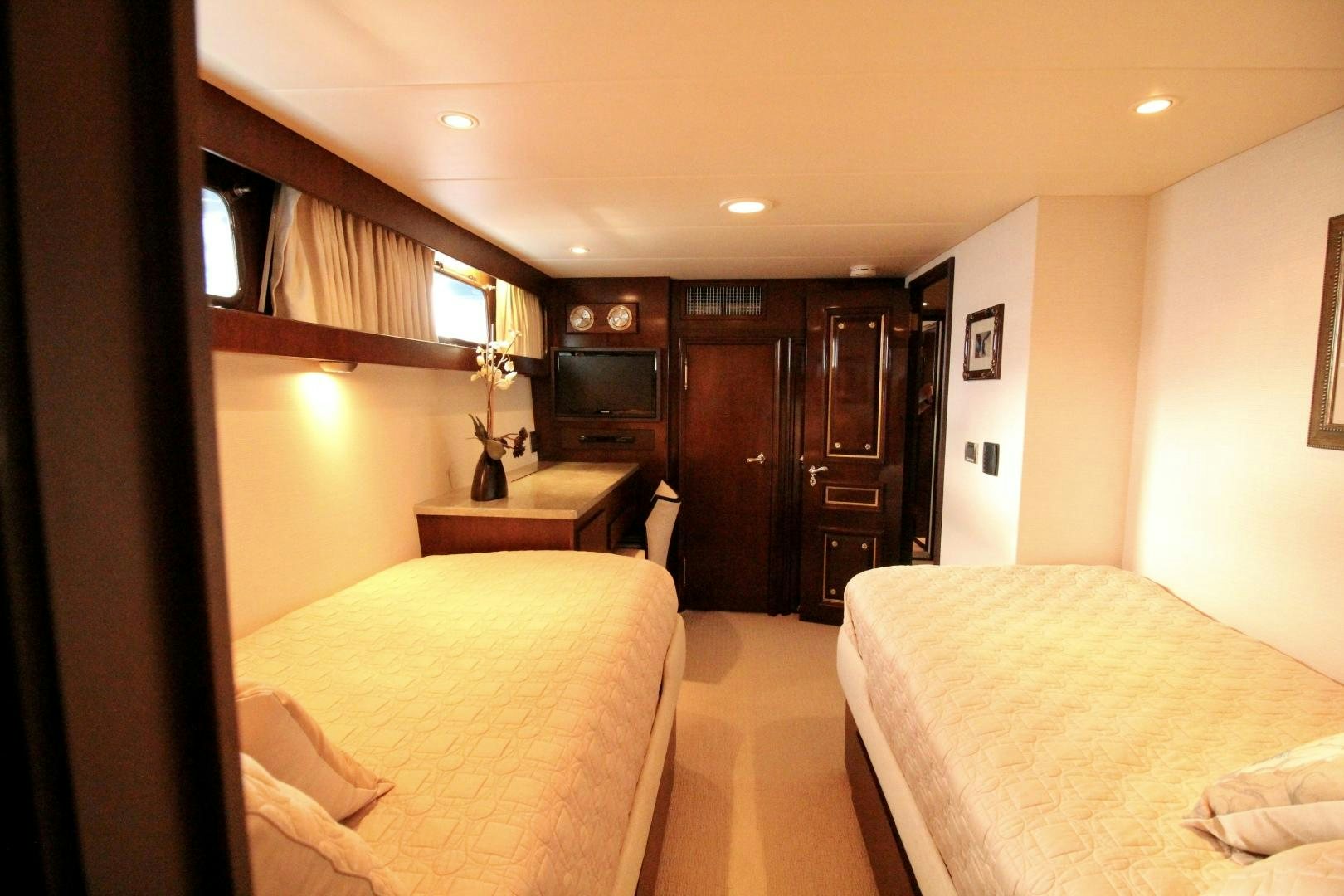 a hotel room with two beds aboard REFLECTIONS Yacht for Sale