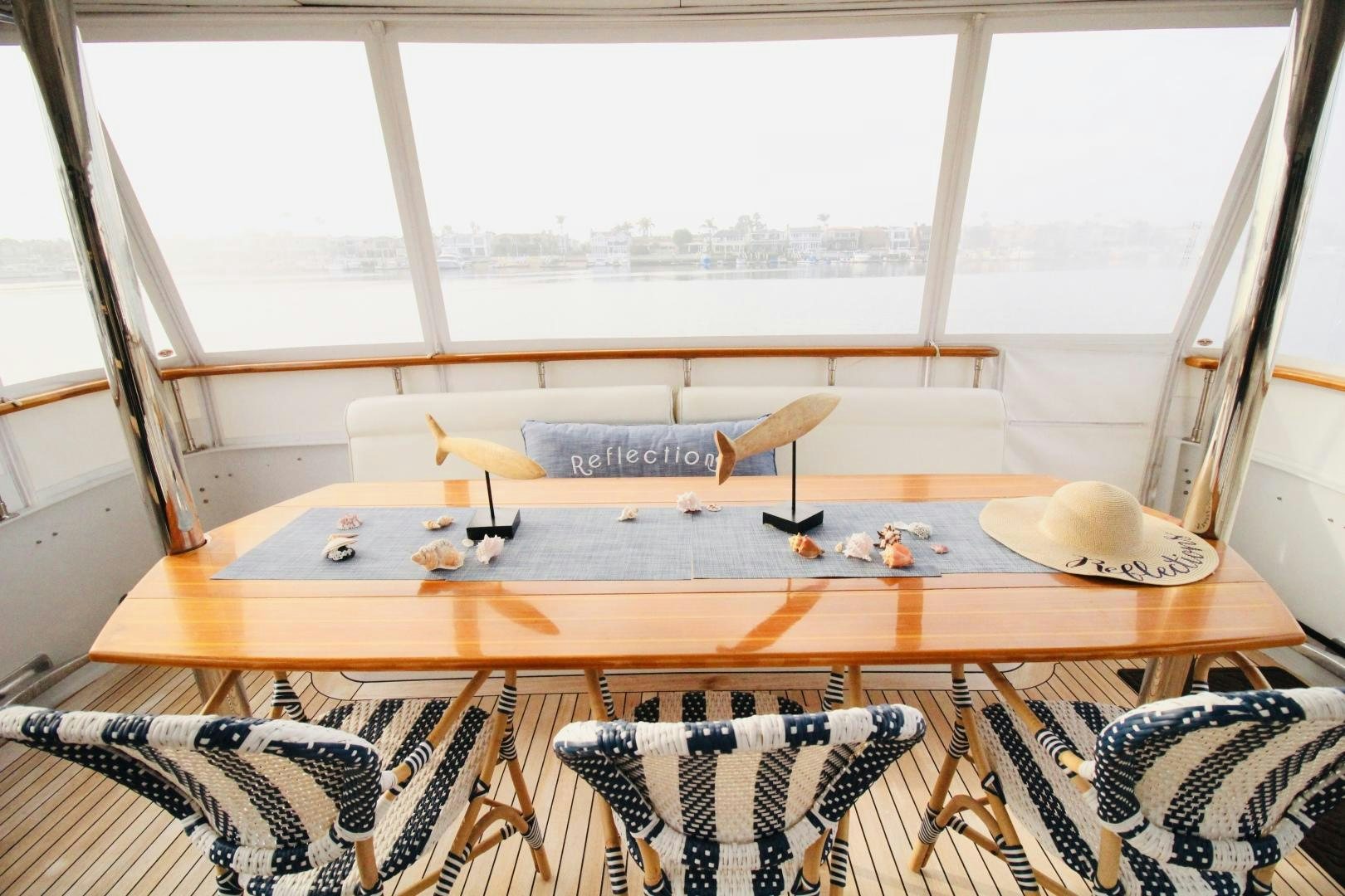 a room with a table and chairs aboard REFLECTIONS Yacht for Sale