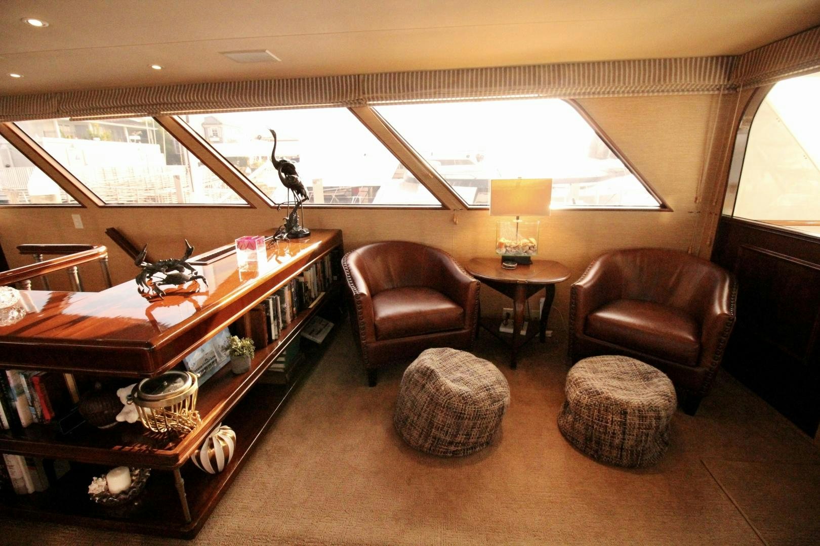 a living room with a desk and a chair aboard REFLECTIONS Yacht for Sale
